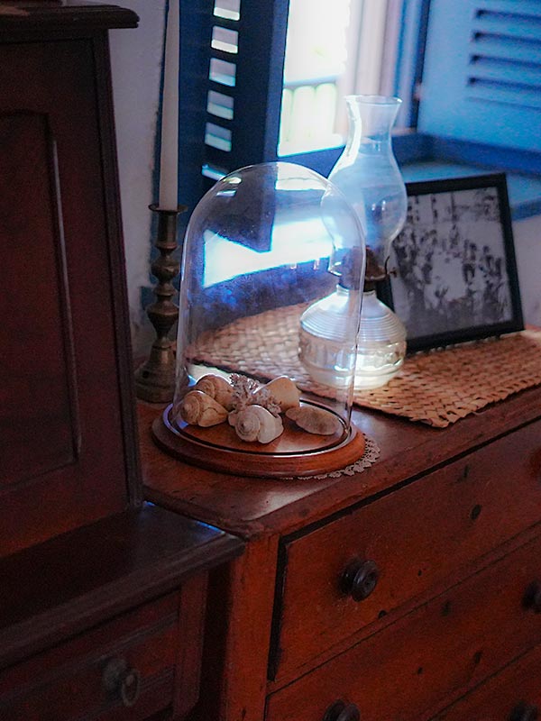 image of decorative items next to the bed at the Baldwin Home.